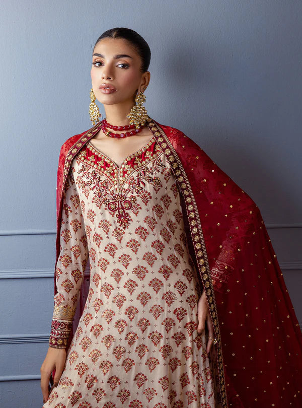 Gulzar by Zainab Chottani ivory frock with maroon block prints, hand embroidery, sequin chan, raw silk trousers, and maroon chiffon dupatta for weddings.