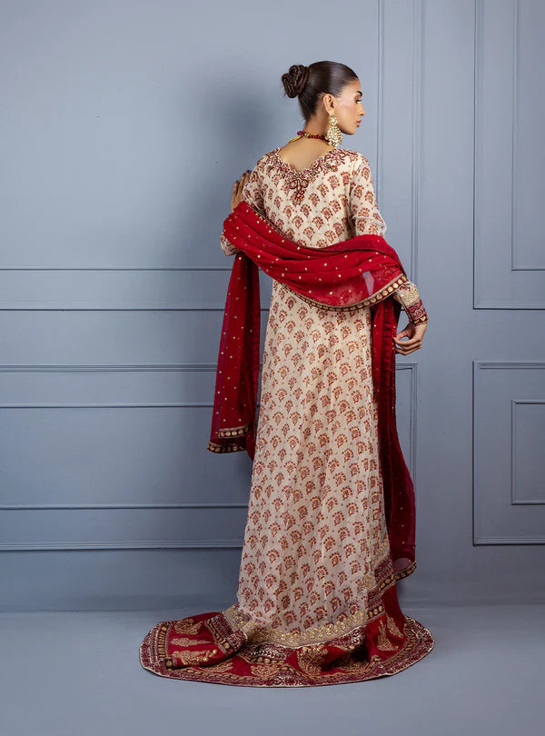Gulzar by Zainab Chottani ivory frock with maroon block prints, hand embroidery, sequin chan, raw silk trousers, and maroon chiffon dupatta for weddings.