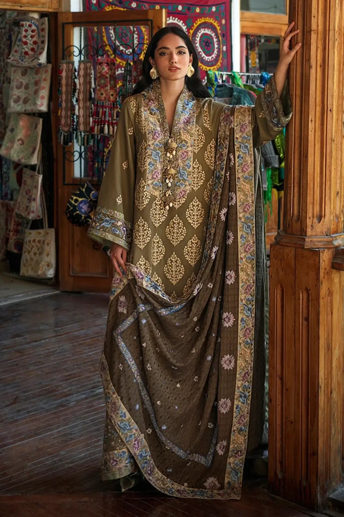 Silk Road by Mushq Broadway Winter 2026 olive green embroidered herringbone stitched winter festive suit with shawl