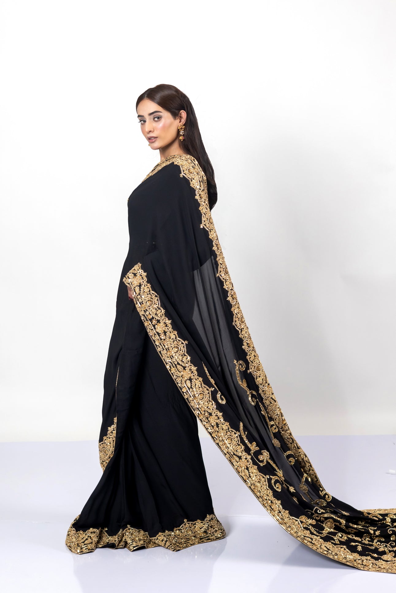 Sofi Black Saree by MariamRaj with gold handwork and Korean silk patti coat for weddings .