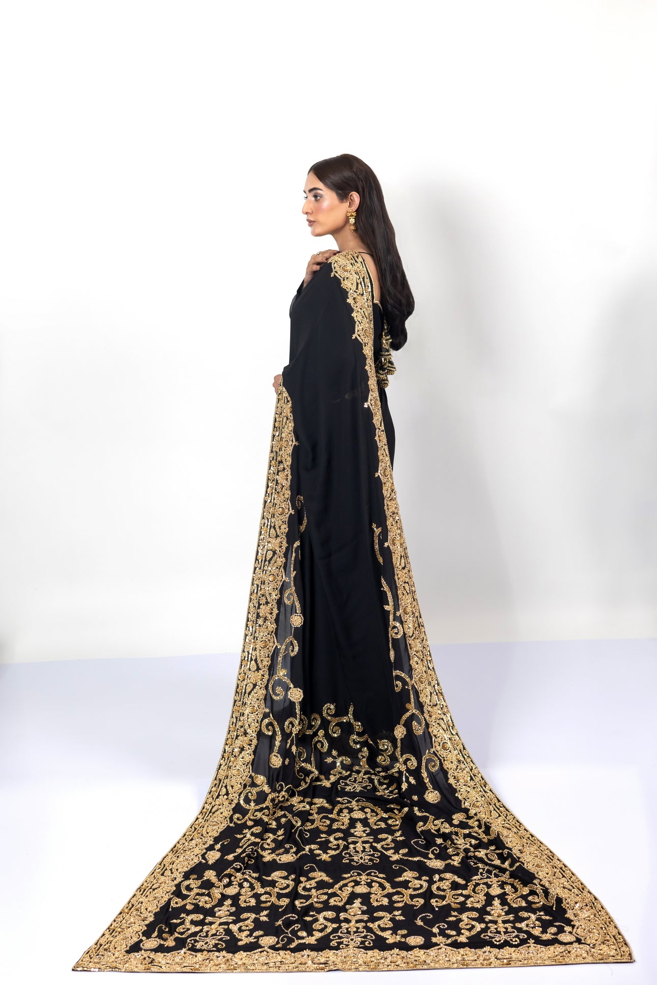 Sofi Black Saree by MariamRaj with gold handwork and Korean silk patti coat for weddings .