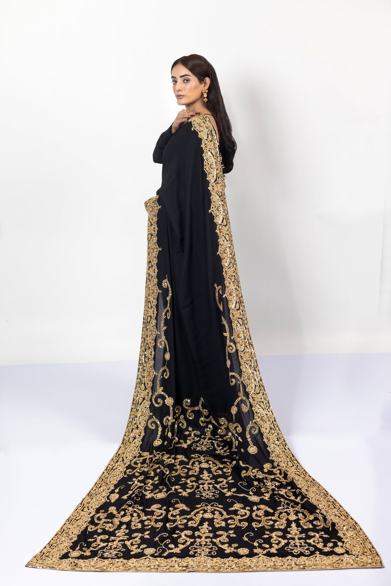 Sofi Black Saree by MariamRaj with gold handwork and Korean silk patti coat for weddings .