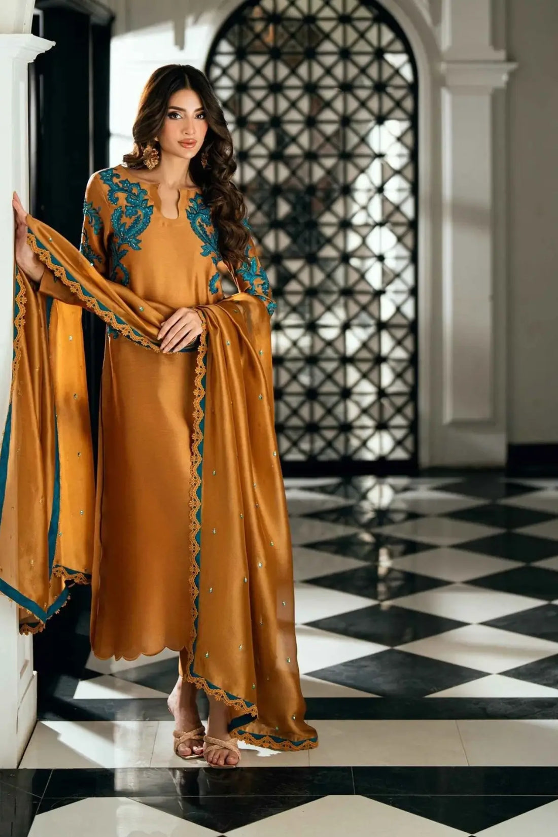 Solara golden stitched viscose silk Pakistani formal dress with ferozi handwork available online at Pakistanimoda.