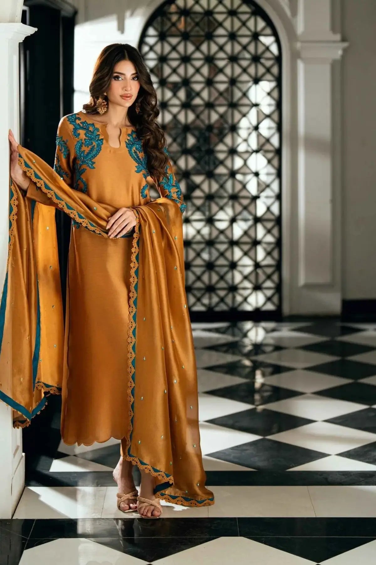 Solara golden stitched viscose silk Pakistani formal dress with ferozi handwork available online at Pakistanimoda.