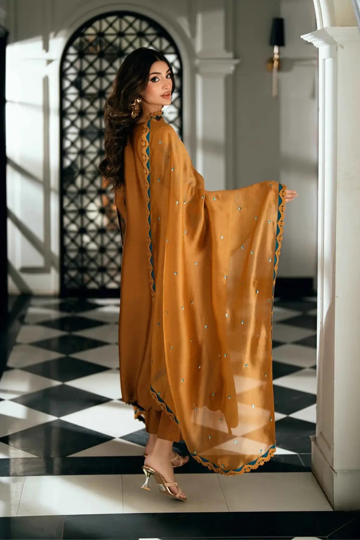 Solara golden stitched viscose silk Pakistani formal dress with ferozi handwork available online at Pakistanimoda.