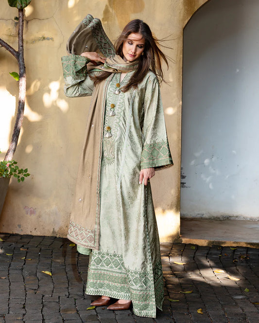 Model wearing Mushq Solare beige brown jacquard embroidered winter dress with dobby shawl – Winter Broadway 2025