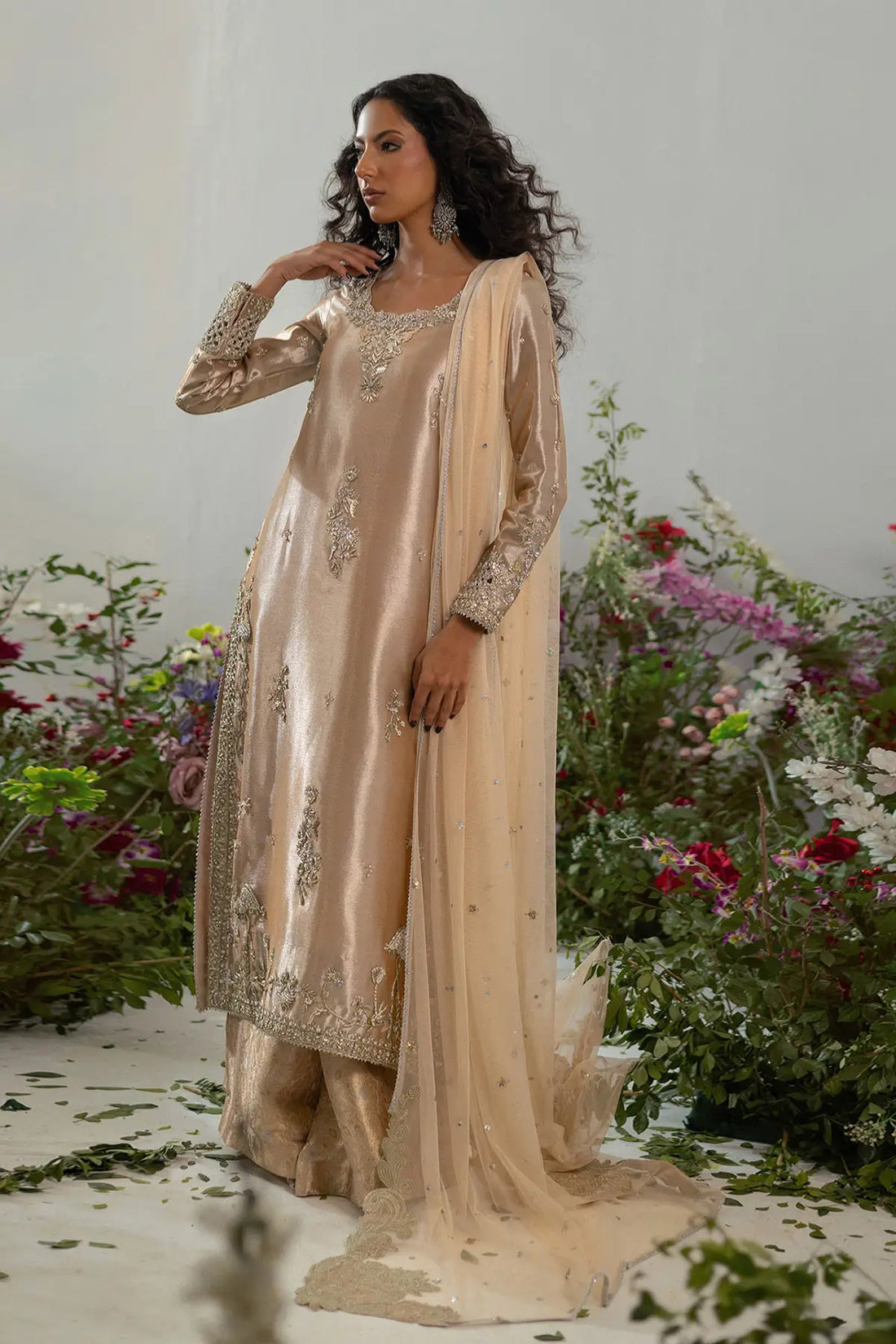 Champagne lamé A-line suit with zardozi and pearl embellishment styled for wedding guest formal wear