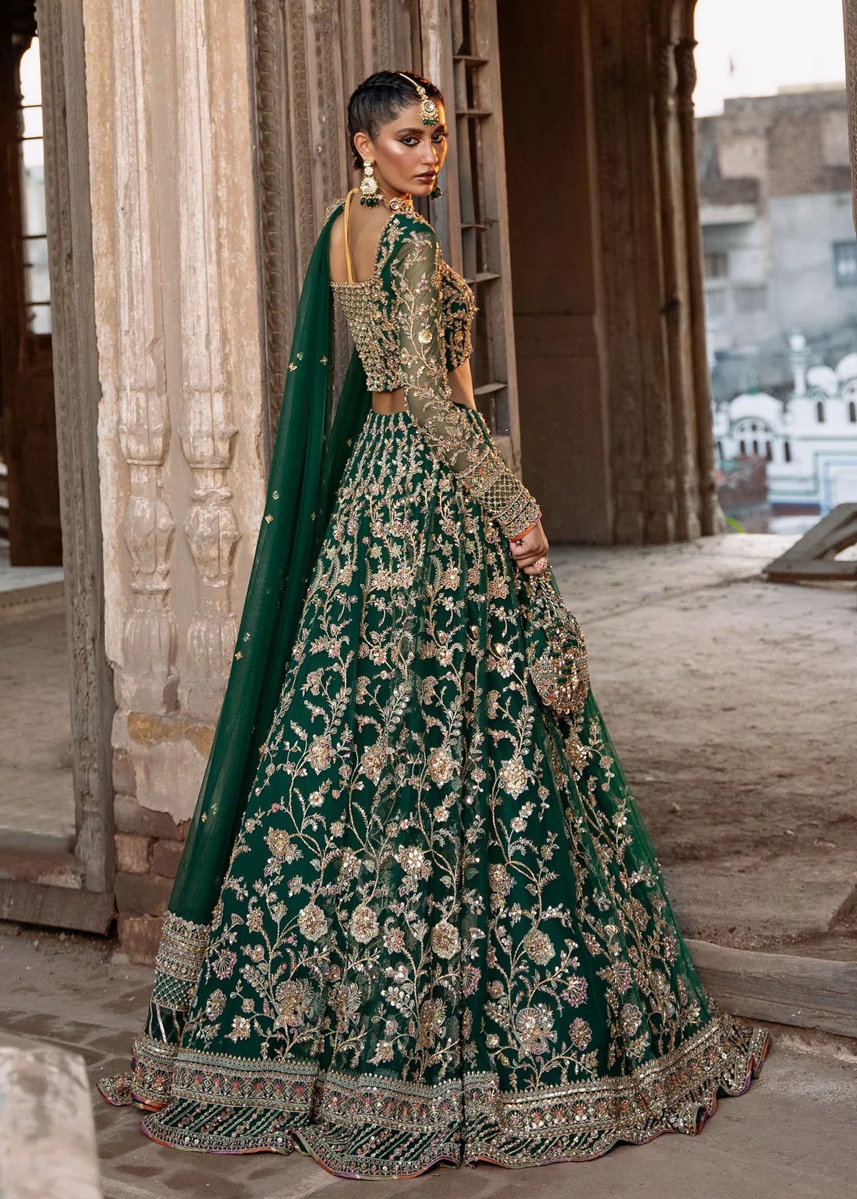 Sukhan stitched bottle green lehenga choli set by Kanwal Malik, featuring floral jaal embroidery, intricate hand embellishments, and net dupatta for weddings.