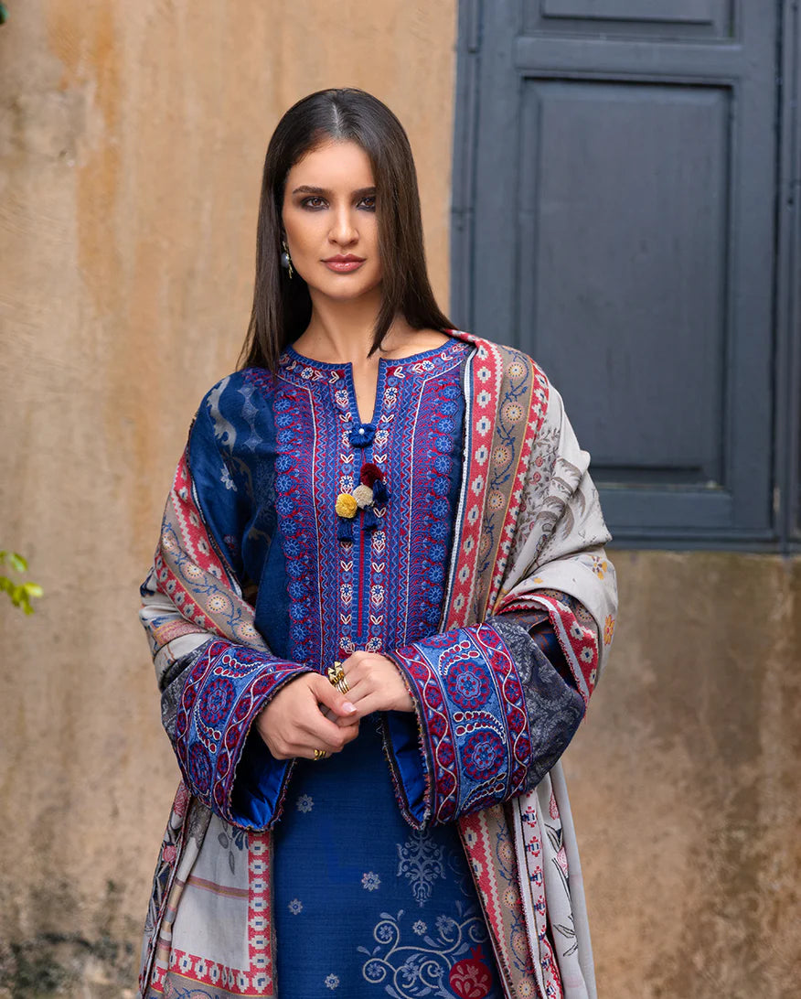 Model wearing Mushq Sunset Promise blue jacquard embroidered winter suit with matching shawl – Winter Broadway 2025