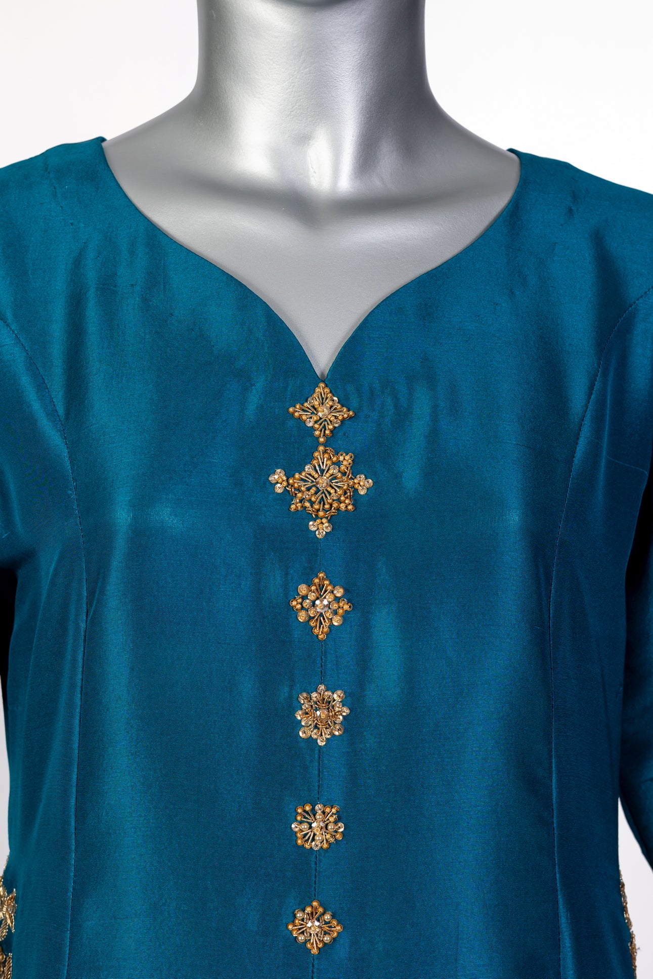 Tara teal raw silk front-open shirt with hand embellishments, straight pants, and chiffon dupatta for parties, dinner events, and formal gatherings by MariamRaj