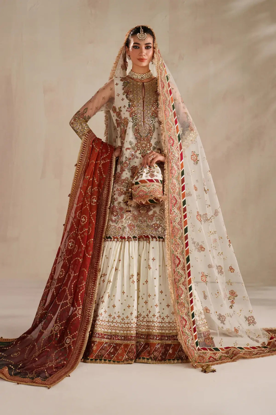 Luxury ivory embroidered net Nikah bridal outfit stitched.