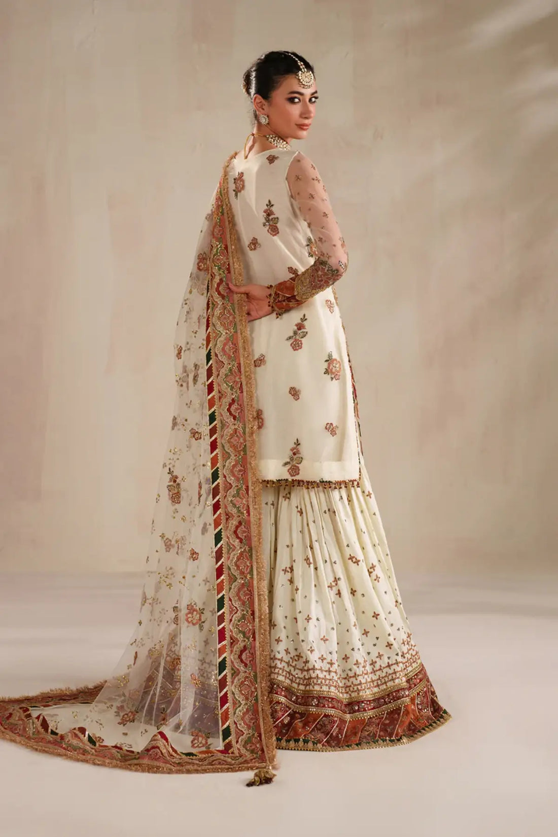 Luxury ivory embroidered net Nikah bridal outfit stitched.