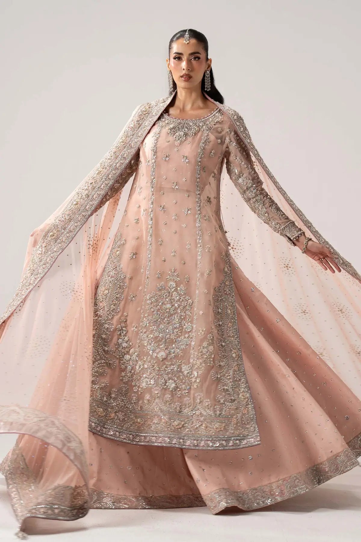Velmira powder pink luxury organza bridal lehenga with tassel silk lehenga and net dupatta by Maria B