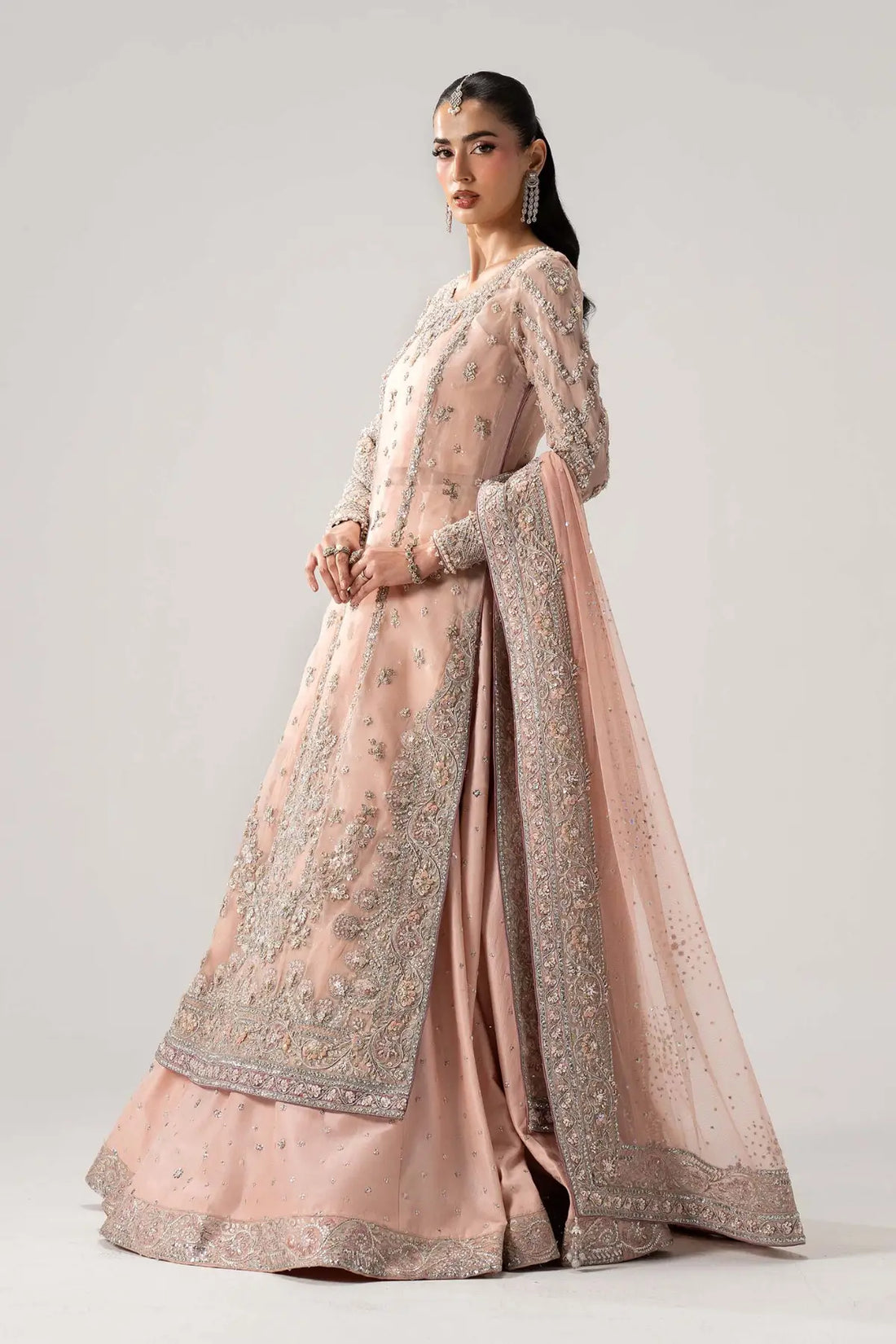 Velmira powder pink luxury organza bridal lehenga with tassel silk lehenga and net dupatta by Maria B