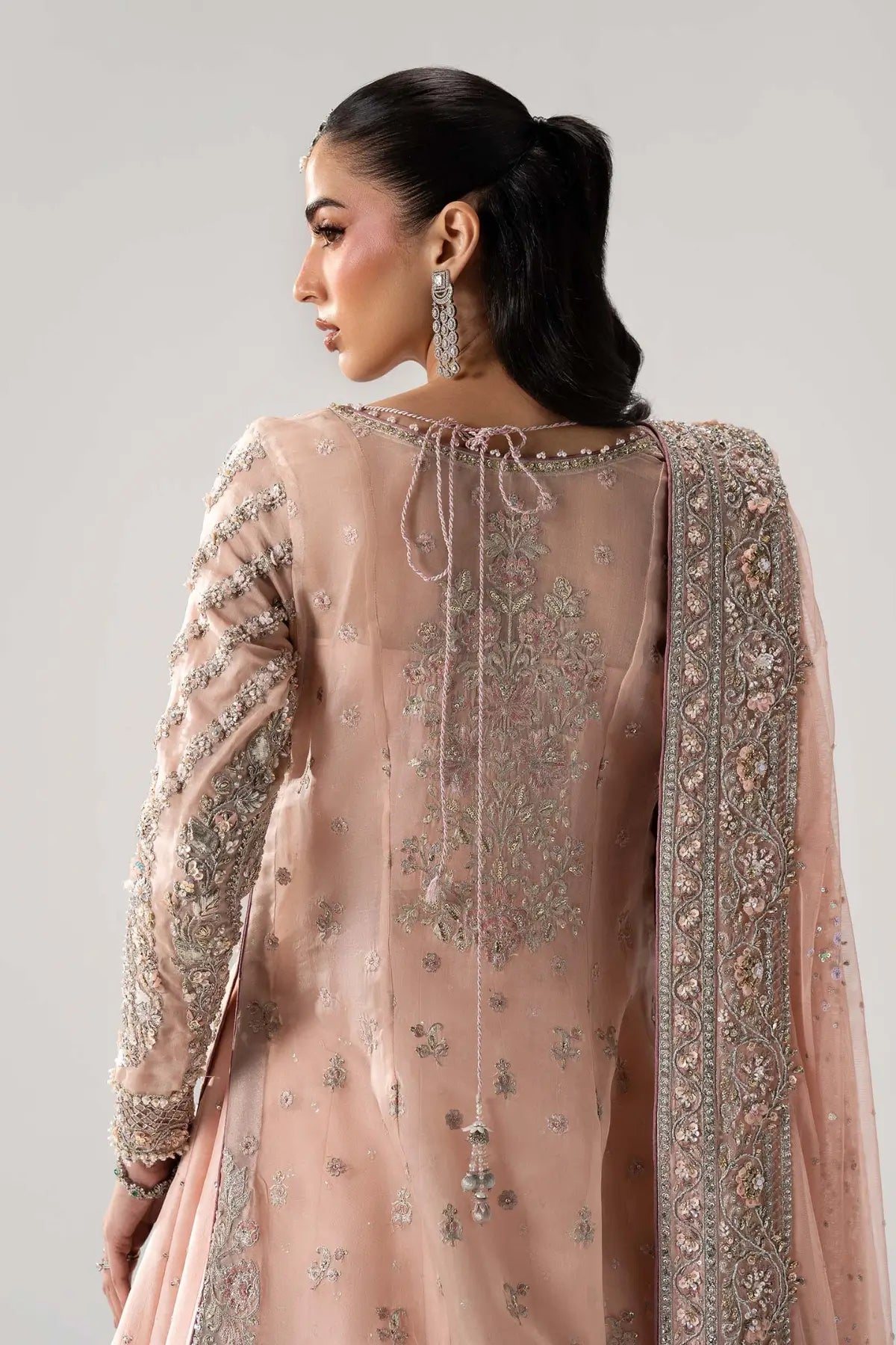 Velmira powder pink luxury organza bridal lehenga with tassel silk lehenga and net dupatta by Maria B