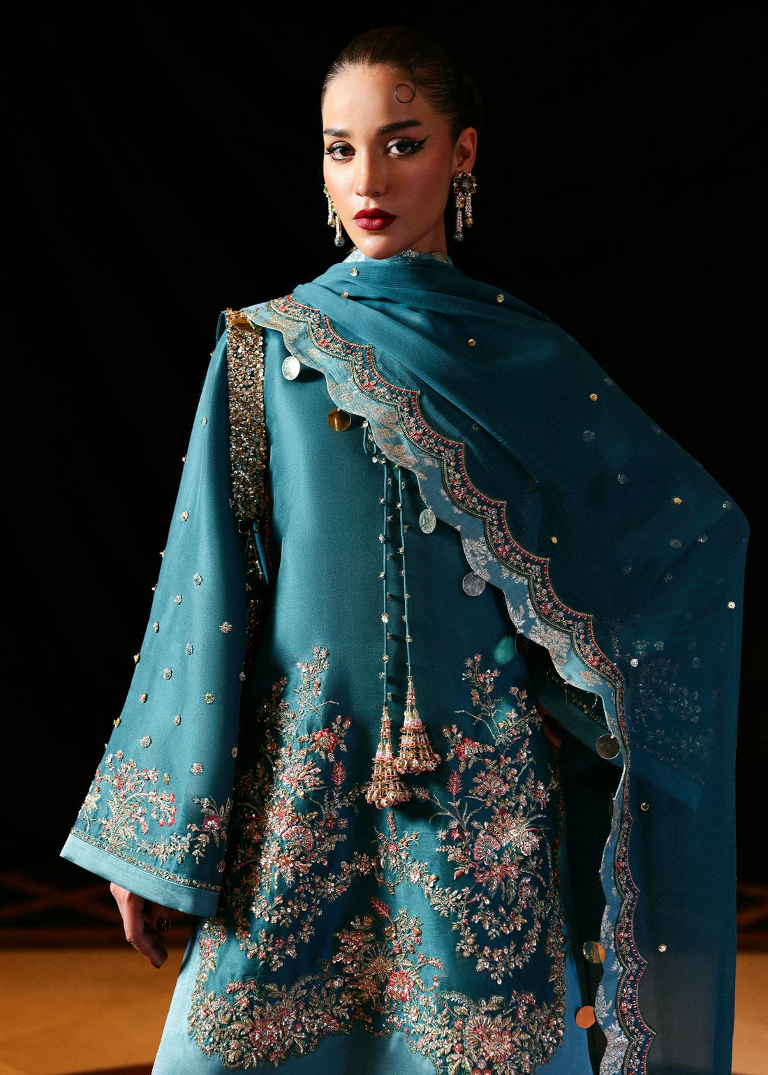 Teal green raw silk embroidered shirt with chiffon dupatta and organza-hem shalwar – Verta three-piece Pakistani formal outfit at Pakistanimoda
