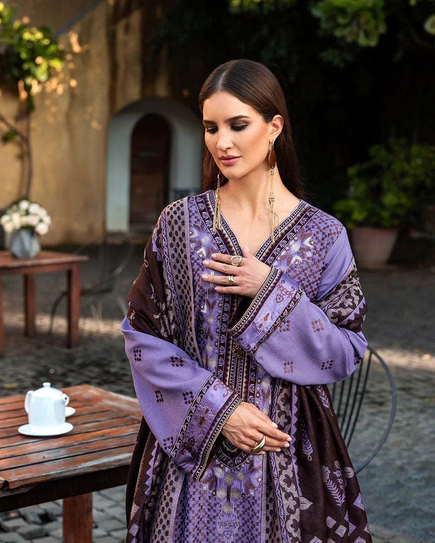 Model wearing Mushq Villa Bramasole muted purple embroidered karandi winter dress with wool shawl – Winter Broadway 2025