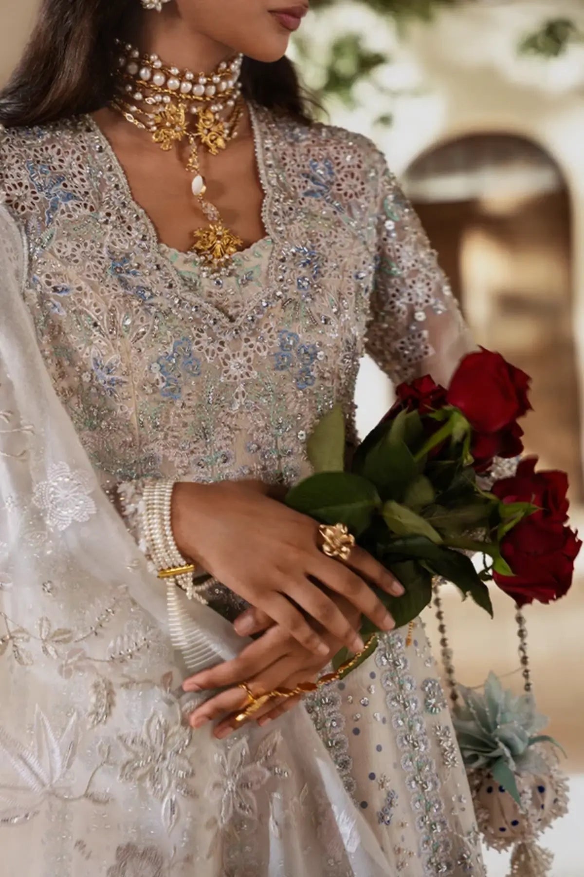 Yasmira off white embellished organza Pakistani formal suit with embroidered shirt, silk lehenga and scalloped organza dupatta