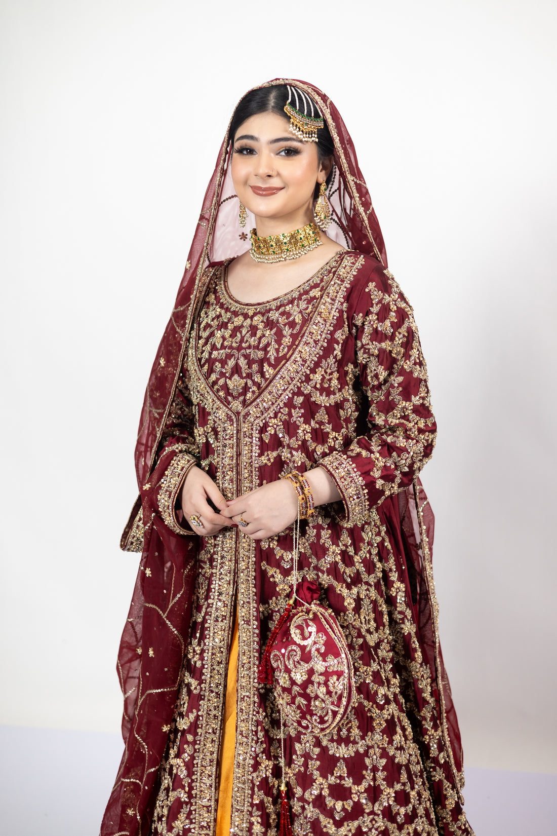 Yumna bridal ensemble by MariamRaj: Maroon raw silk front-open shirt, rust farshi lehnga, net organza dupatta, intricate embroidery for weddings and receptions