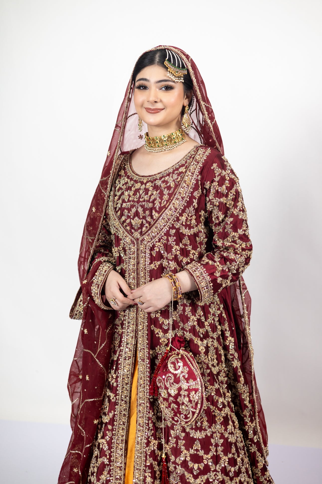 Yumna bridal ensemble by MariamRaj: Maroon raw silk front-open shirt, rust farshi lehnga, net organza dupatta, intricate embroidery for weddings and receptions