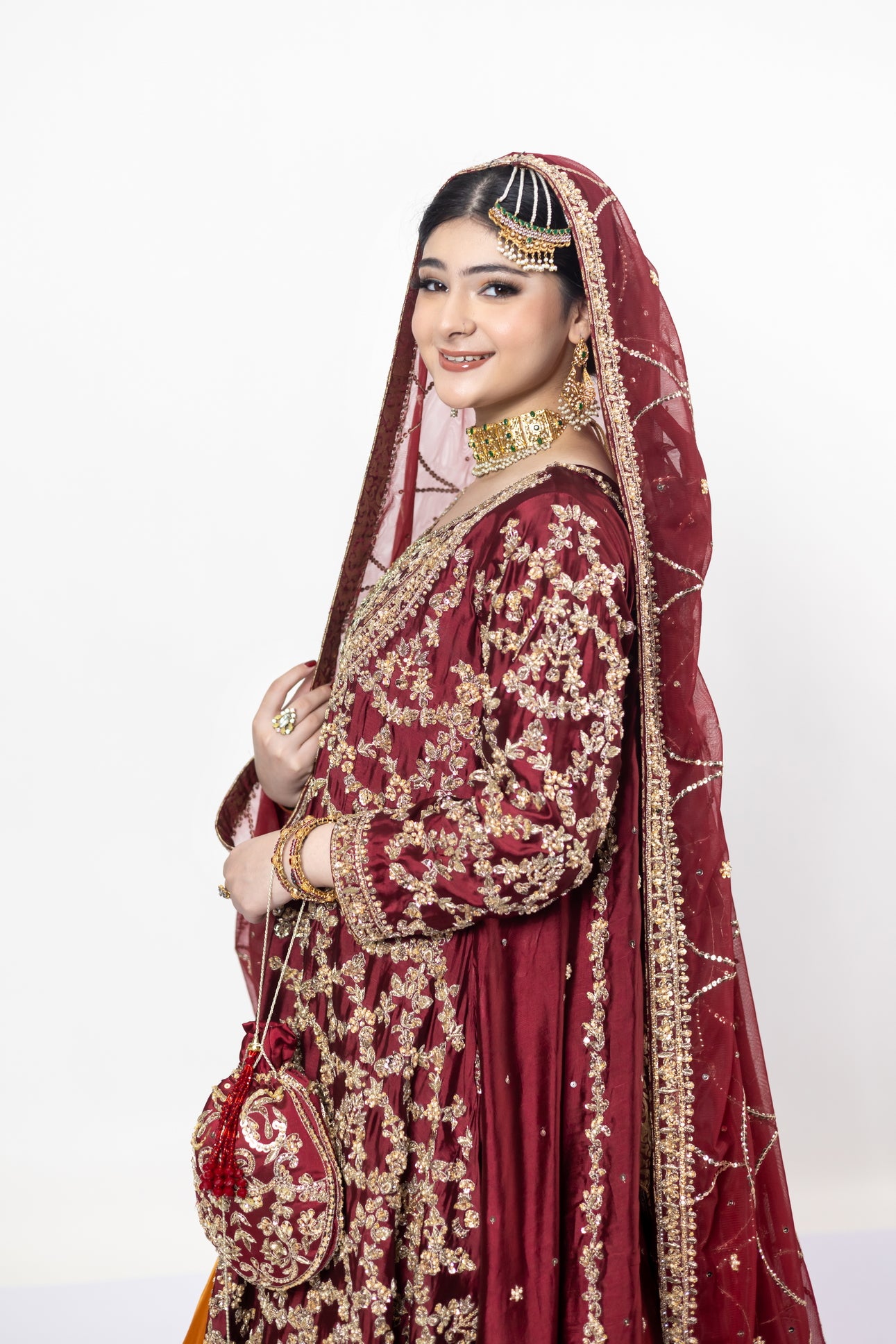 Yumna bridal ensemble by MariamRaj: Maroon raw silk front-open shirt, rust farshi lehnga, net organza dupatta, intricate embroidery for weddings and receptions