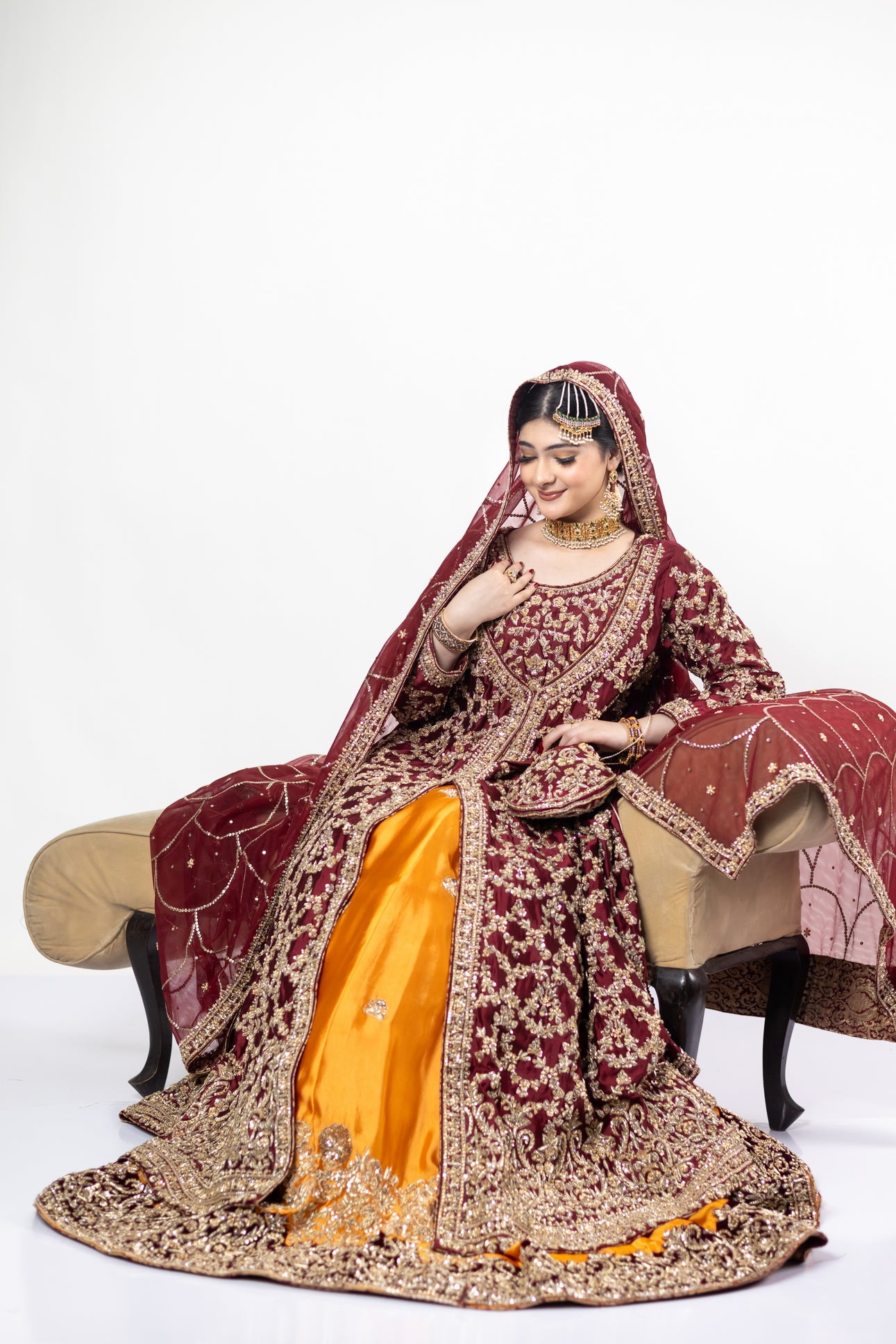 Yumna bridal ensemble by MariamRaj: Maroon raw silk front-open shirt, rust farshi lehnga, net organza dupatta, intricate embroidery for weddings and receptions