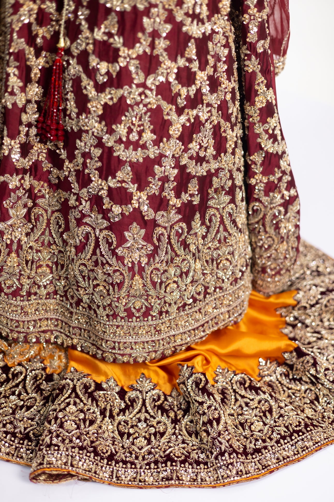 Yumna bridal ensemble by MariamRaj: Maroon raw silk front-open shirt, rust farshi lehnga, net organza dupatta, intricate embroidery for weddings and receptions