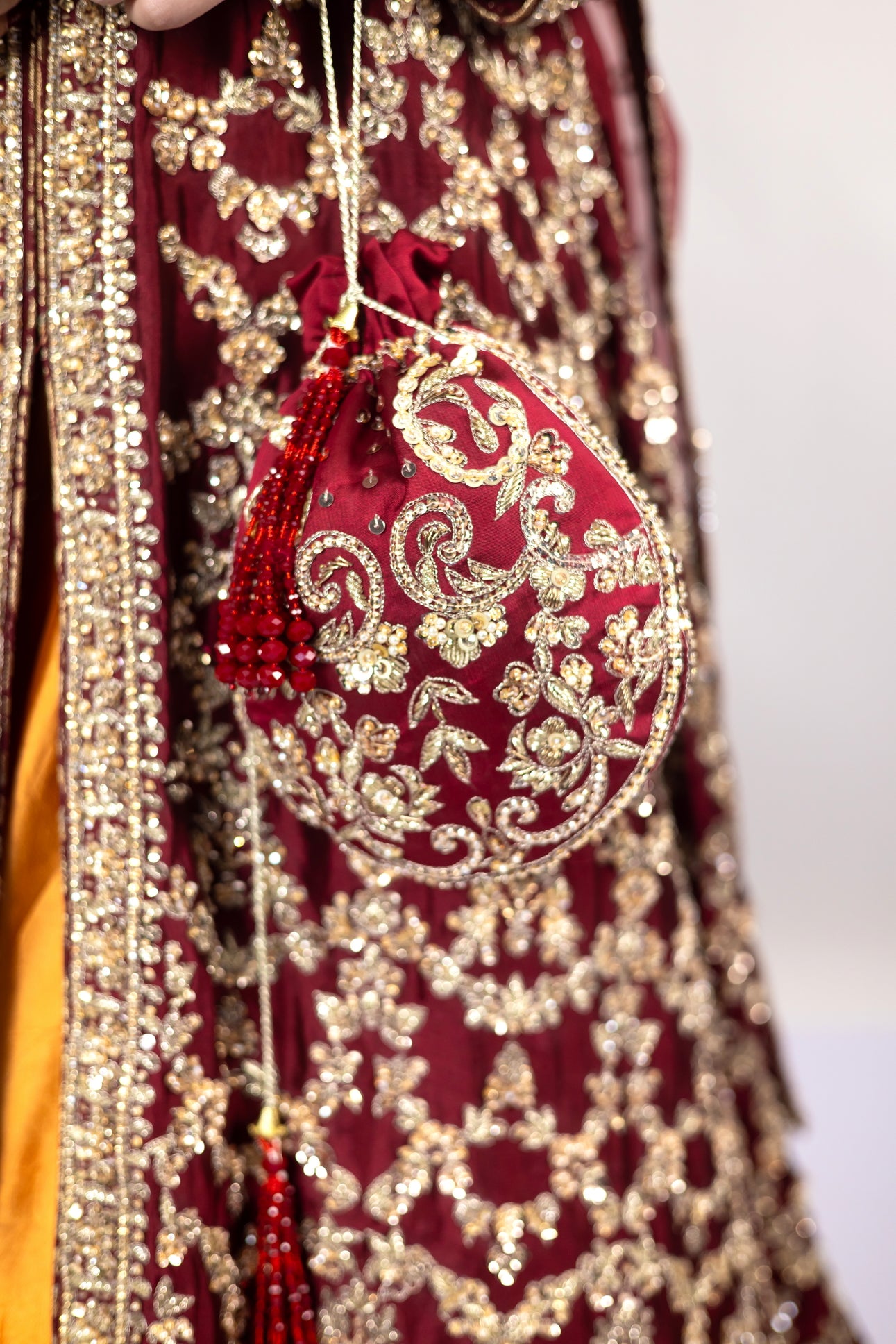 Yumna bridal ensemble by MariamRaj: Maroon raw silk front-open shirt, rust farshi lehnga, net organza dupatta, intricate embroidery for weddings and receptions