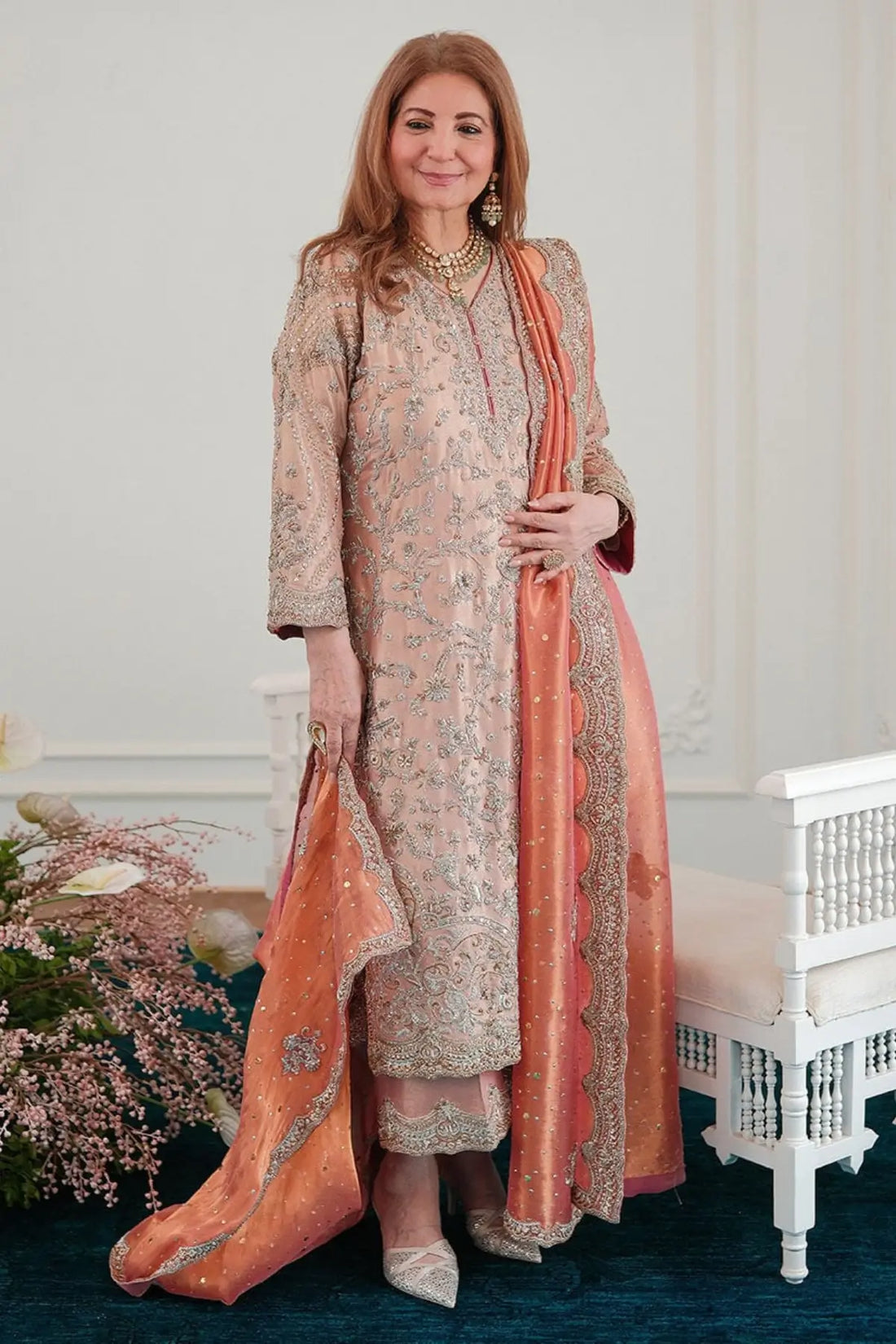 Zahia rose gold stitched formal dress for wedding guests at Pakistanimoda with hand embellishment, lame silk shirt and worked izaar