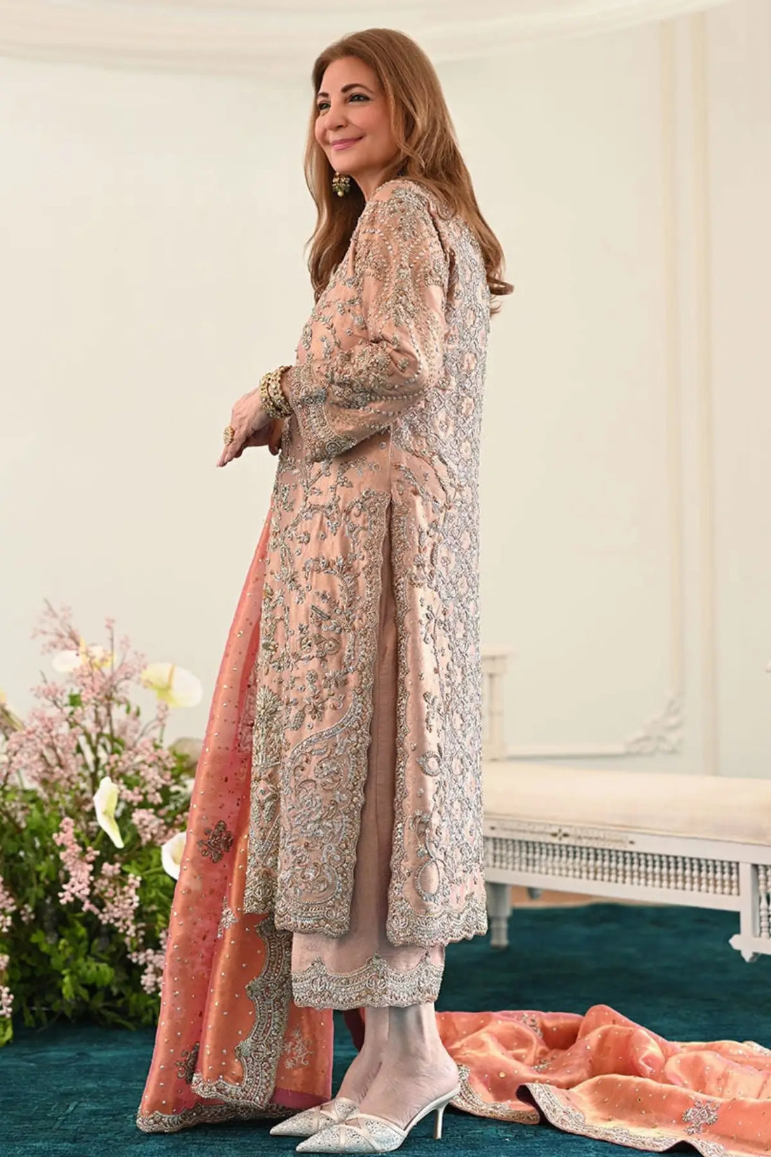 Zahia rose gold stitched formal dress for wedding guests at Pakistanimoda with hand embellishment, lame silk shirt and worked izaar
