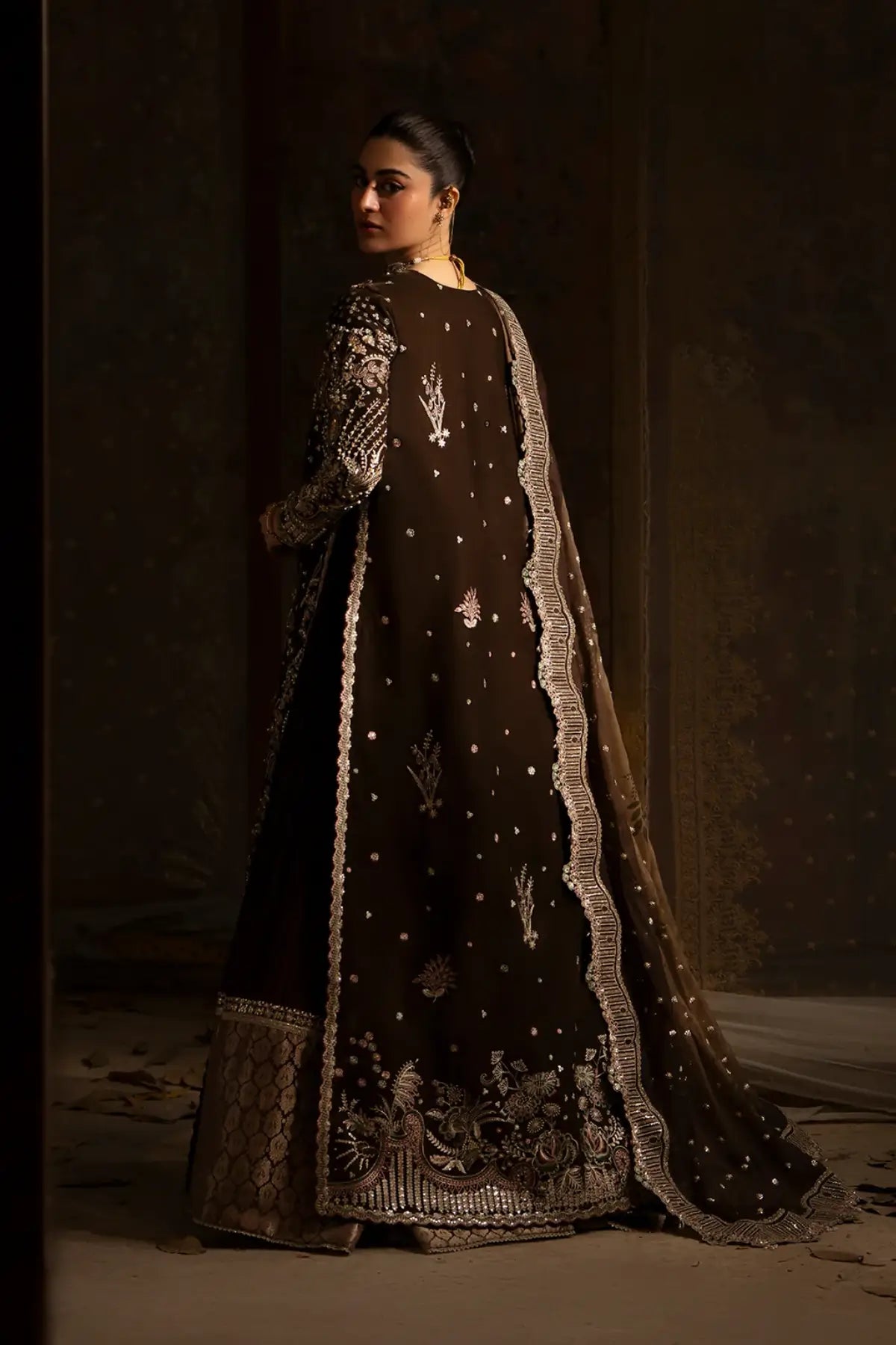Nyra velvet brown luxury stitched Eid wear outfit with detailed embroidery and embellishments.