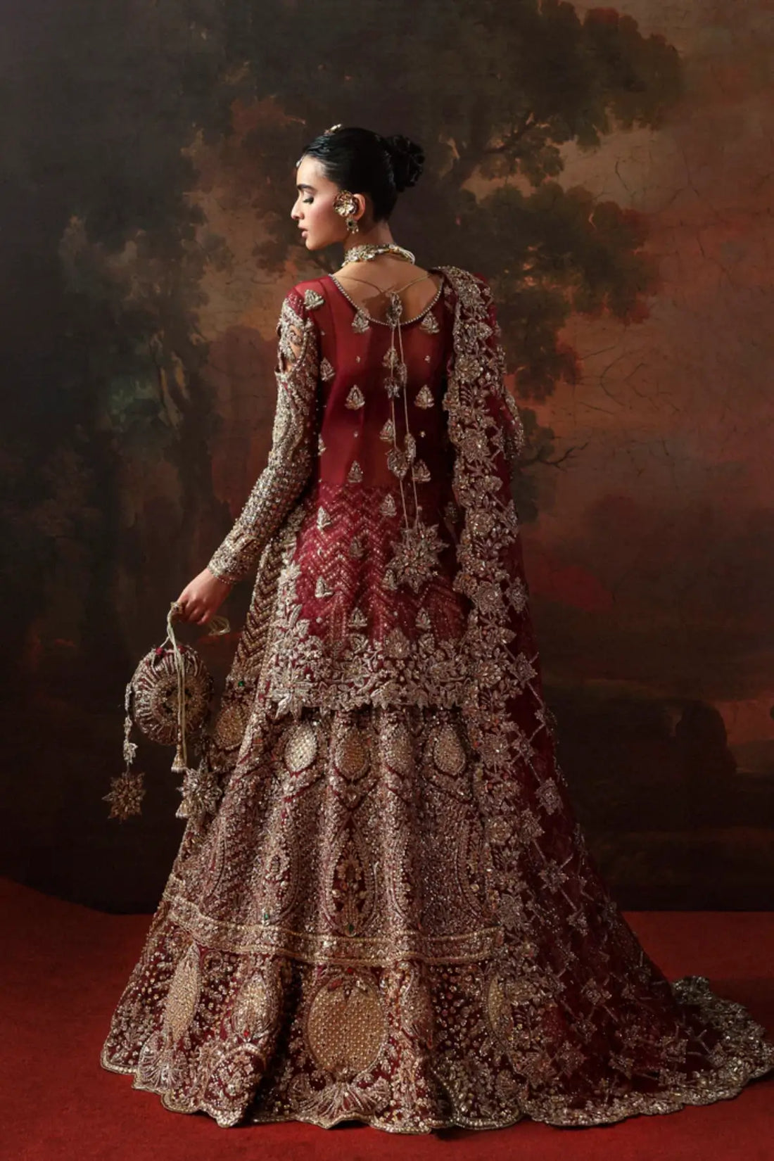 Zarielle maroon bridal lehenga kurti from Akbar Aslam Serena Bridal Edit '26 crafted in organza with silk inner.