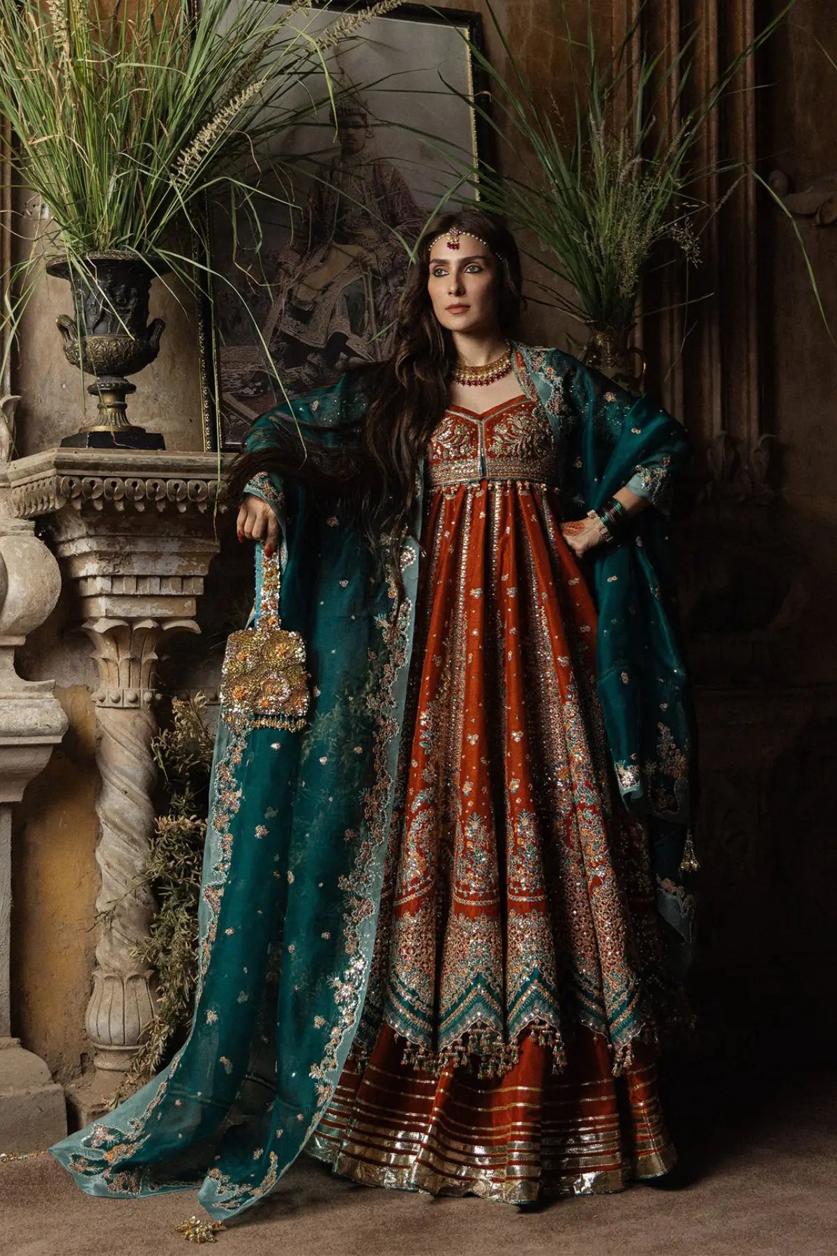 Zarin Hussain Rehar rust orange embellished stitched Peshwas and lehenga with emerald green embroidered organza dupatta