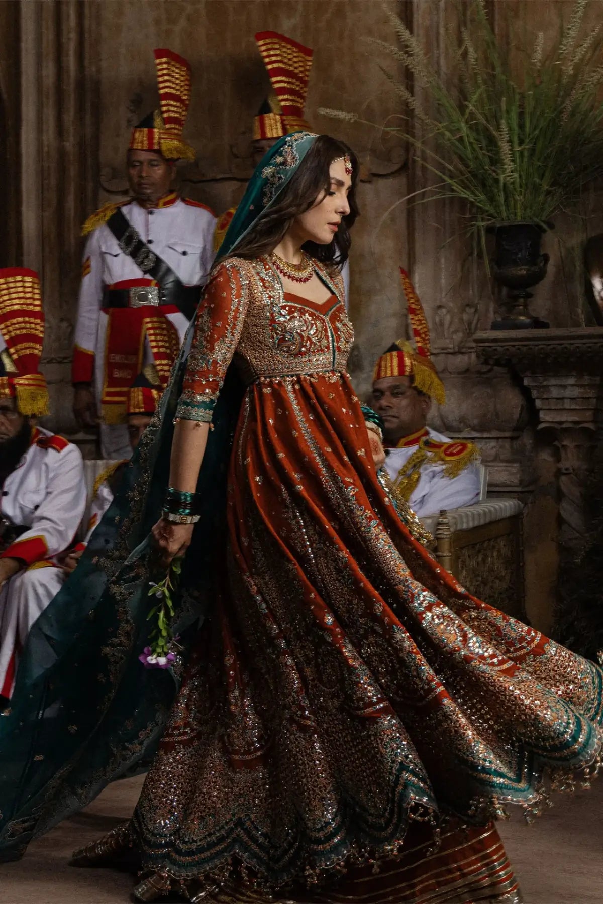 Zarin Hussain Rehar rust orange embellished stitched Peshwas and lehenga with emerald green embroidered organza dupatta