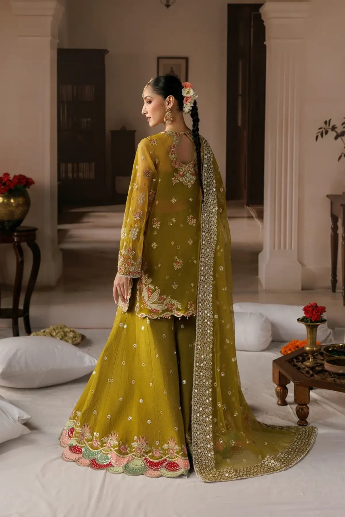 Zarminay dark yellow embroidered organza stitched Mehndi dress with floral detailing, raw silk trouser and embellished poly net dupatta