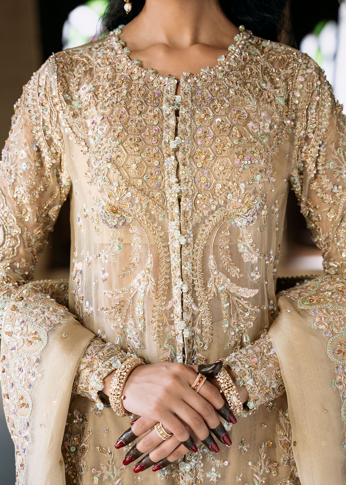 Zarnab nude stitched 4-piece outfit by Kanwal Malik with embellished open gown shirt, bustier, sharara, and organza dupatta for formal occasions.