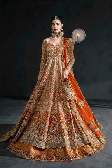 Orange bridal lehenga with gold embroidery, full sleeves, and scalloped dupatta – perfect for South Asian weddings abroad.