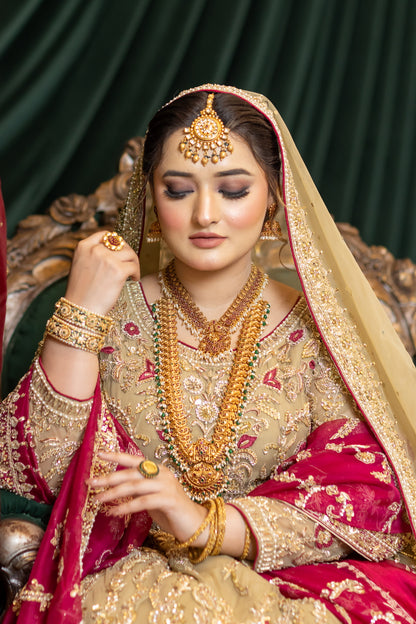 Zuleikha Pakistani bridal wear gold net maxi with red organza dupatta & silk pants – couture outfit by MariamRaj.com.